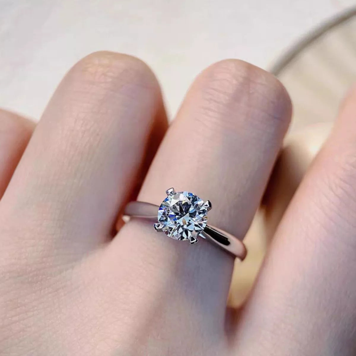 Moissanite ring photographed with the matching gift box
