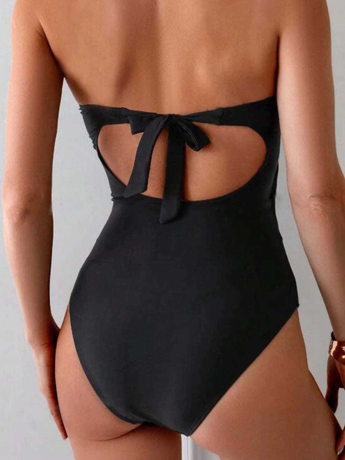 Black cutout swimsuit sweetheart neckline detail