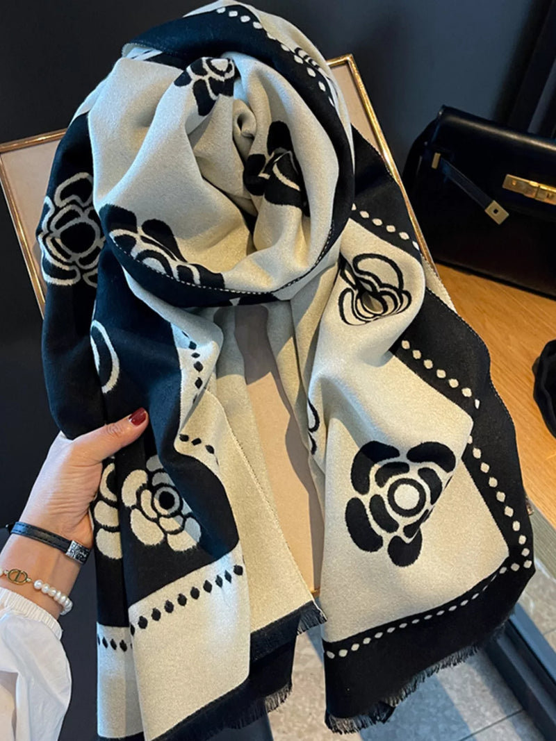 Black floral pattern raw hem scarf shown at full length