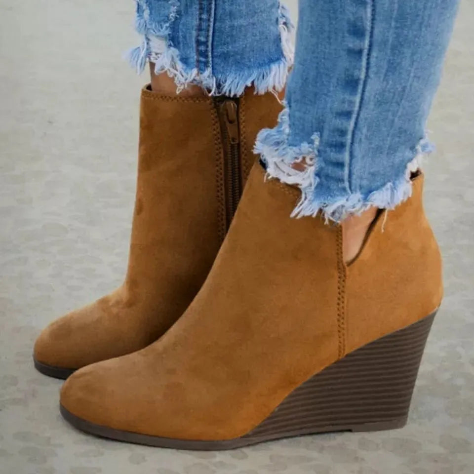Black high heel ankle boots with side zip angled three quarter view