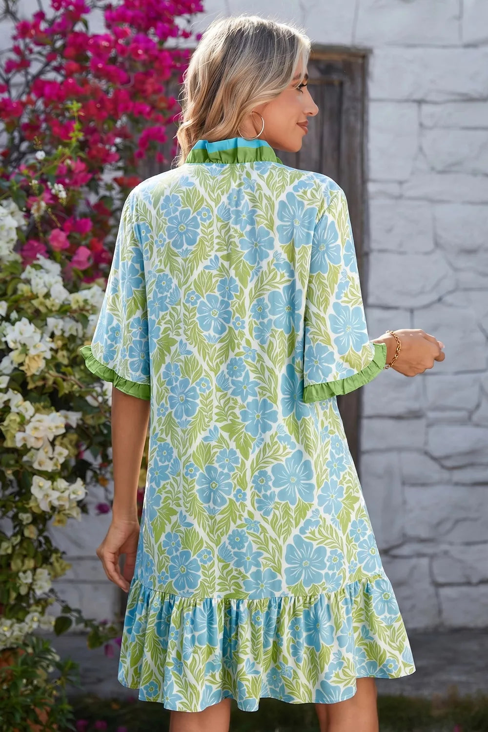 Green floral mini dress on model