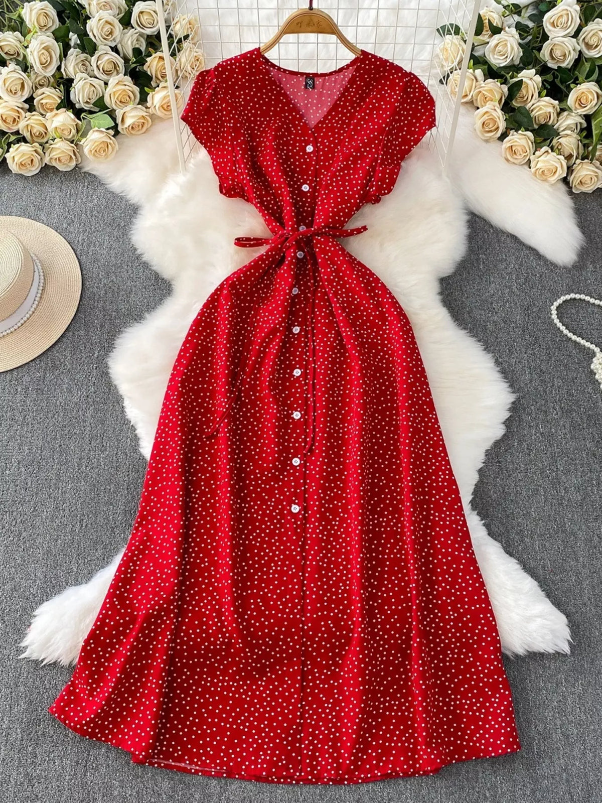 Pink polka dot button up maxi dress side view