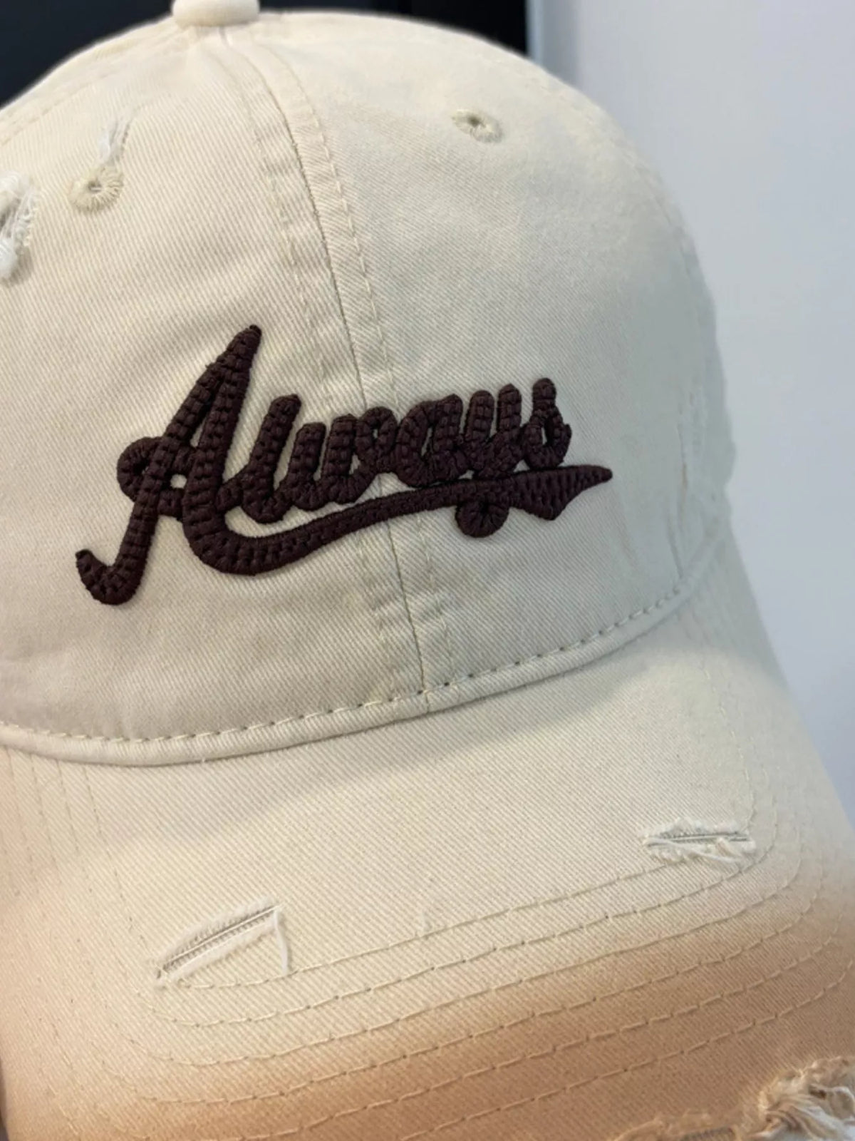 Back view of the beige distressed baseball cap