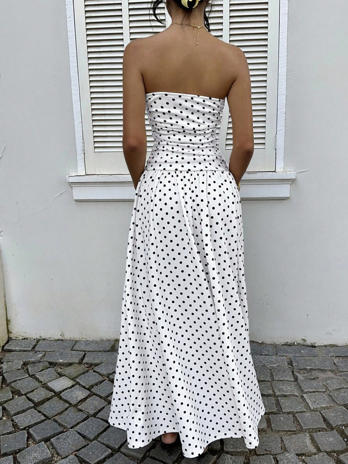 Strapless maxi dress side view showing drape