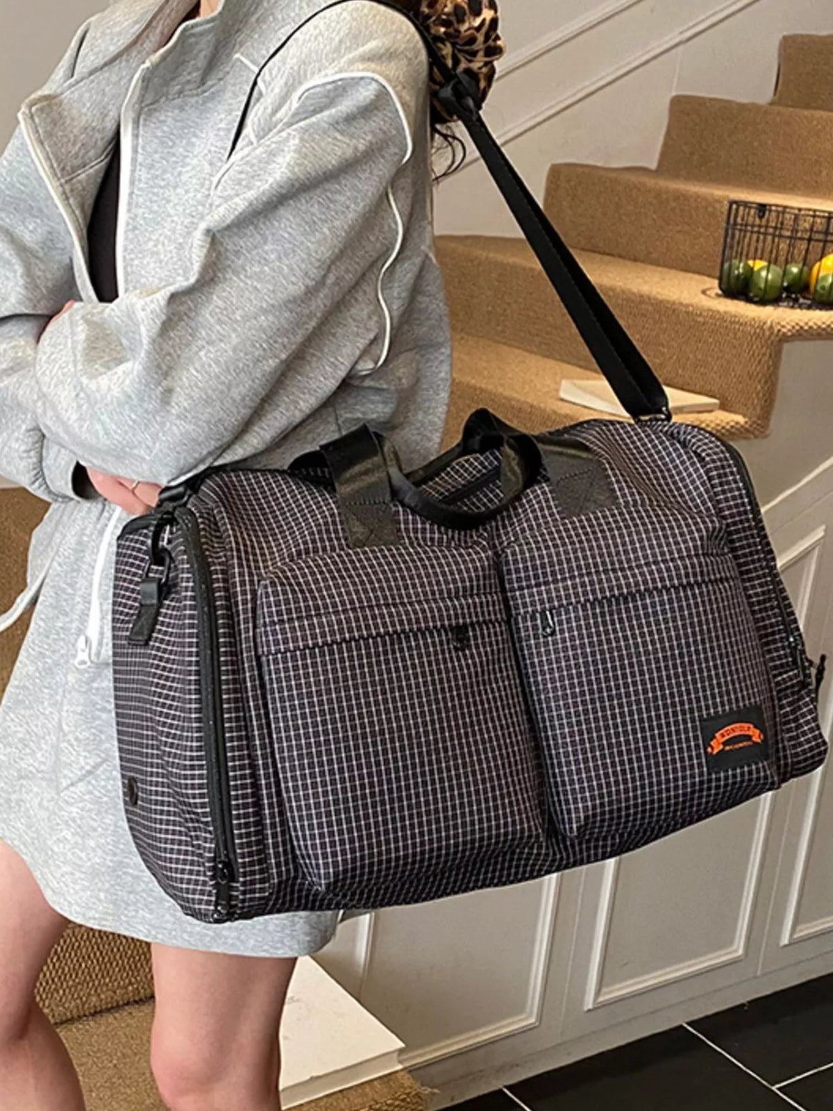 Black duffel bag handle detail