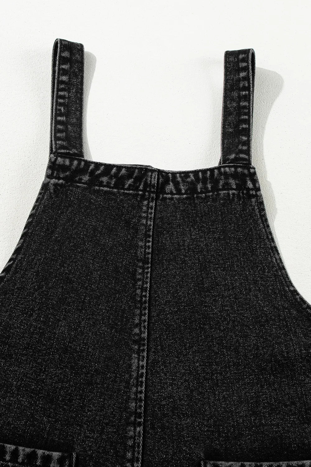 Distressed overalls worn with white tee