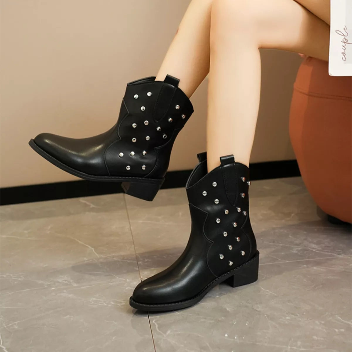Studded western ankle boots standing pair