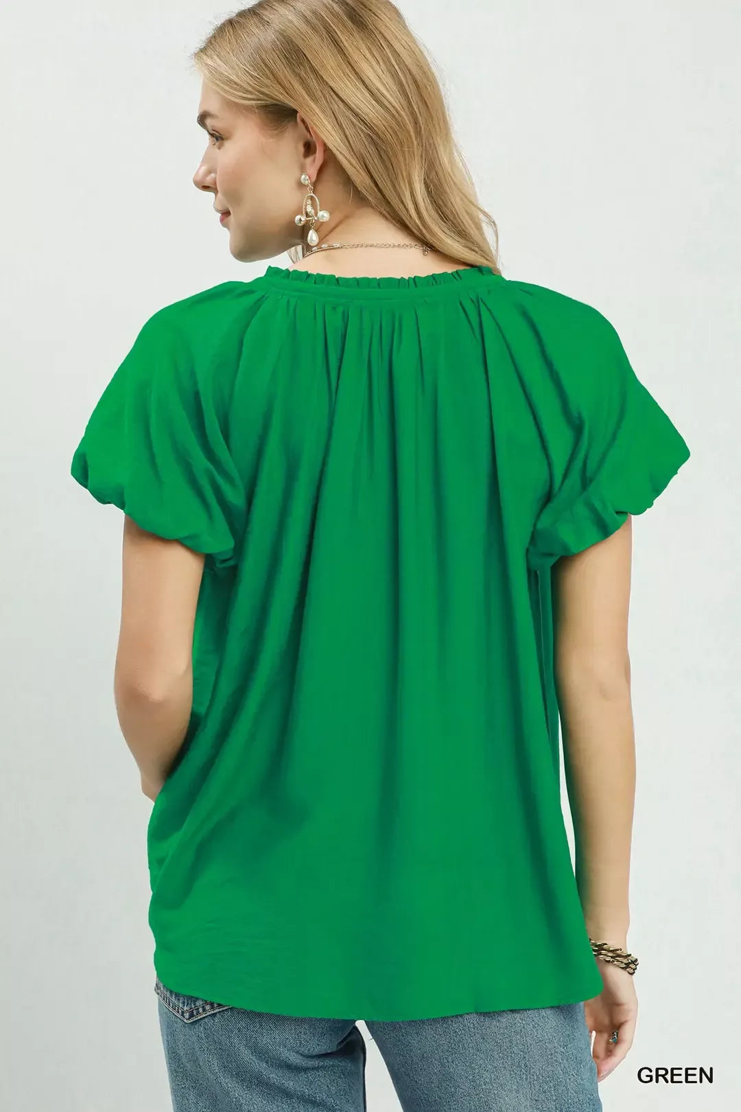 green gathered V neck top side view