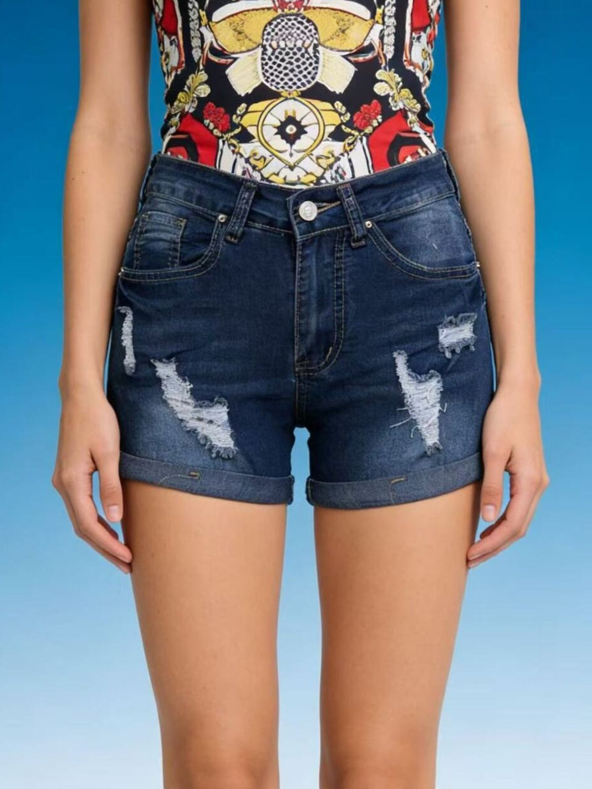 Close up of distressing on denim shorts
