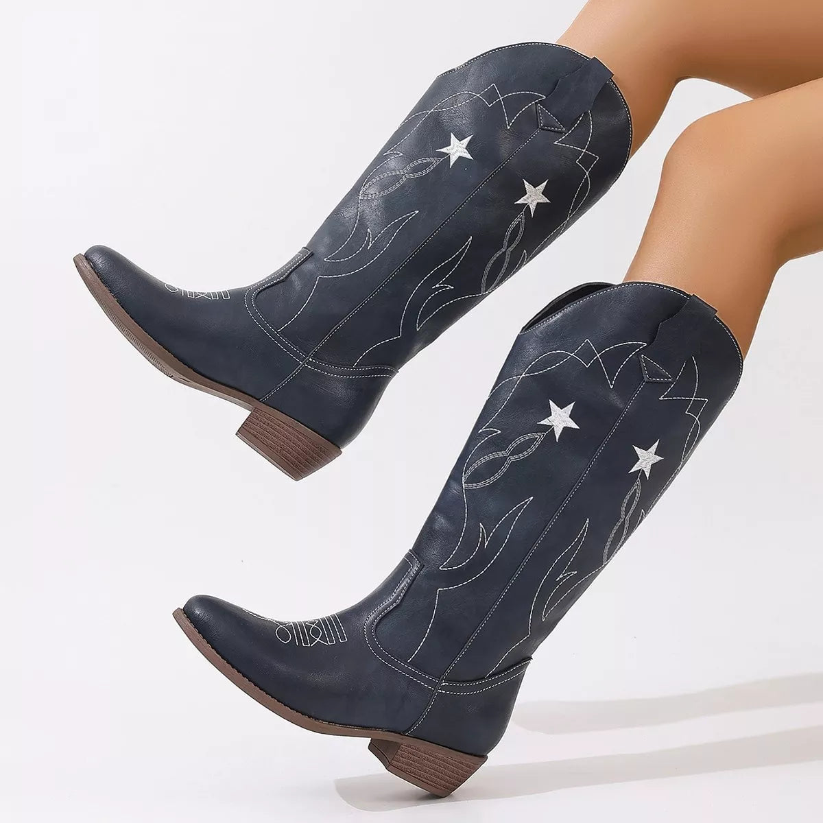 Western star embroidered cowboy boots angled view