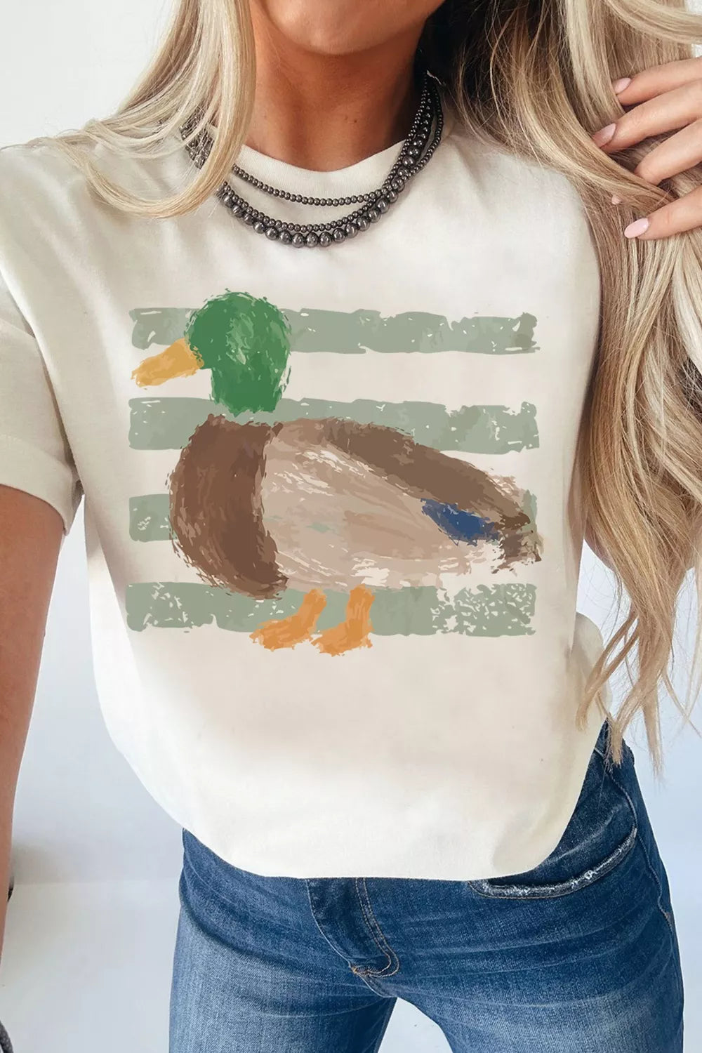 Graffiti duck print detail on the white graphic tee