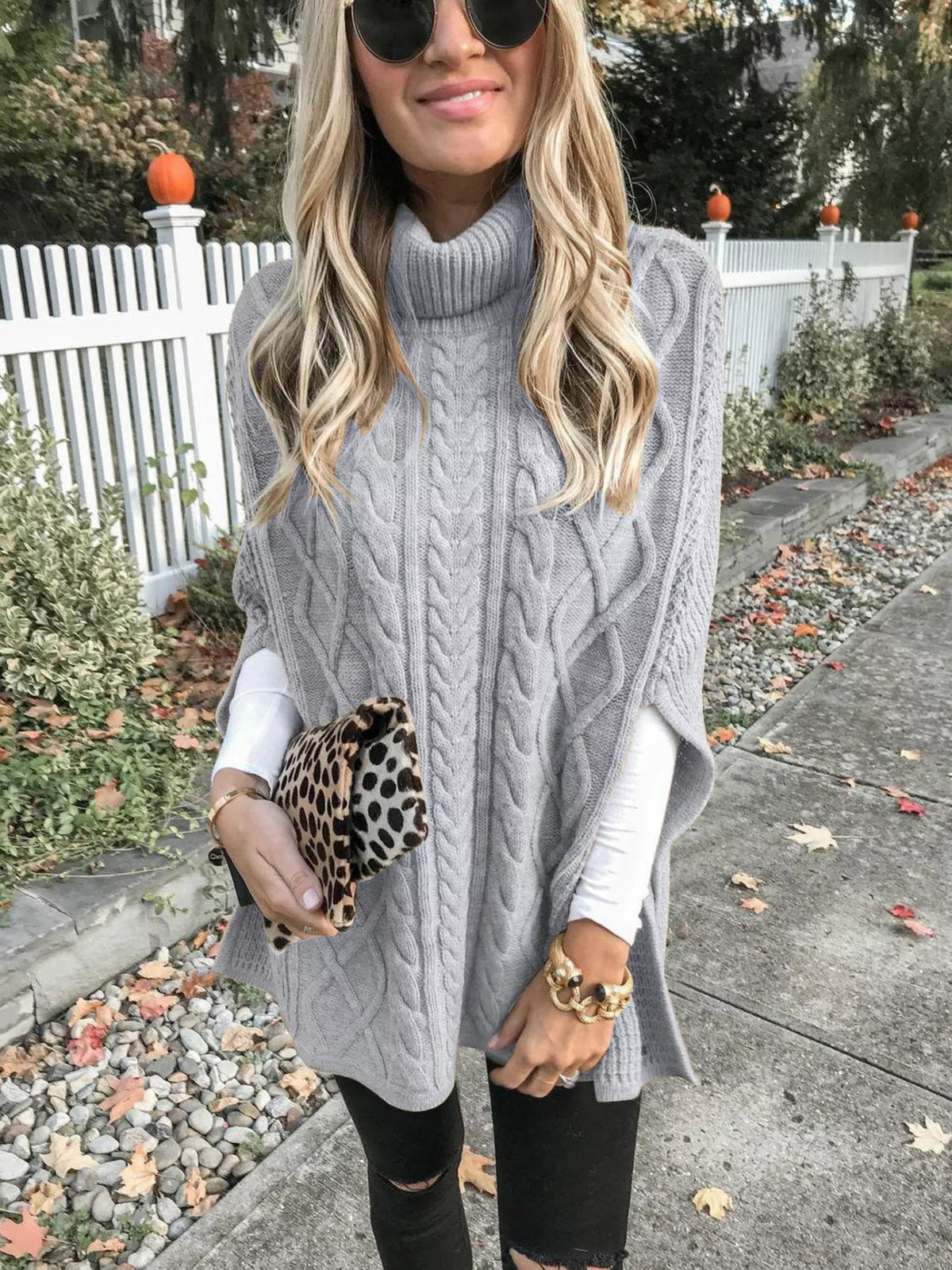 Chunky cable knit turtleneck poncho styled outfit view