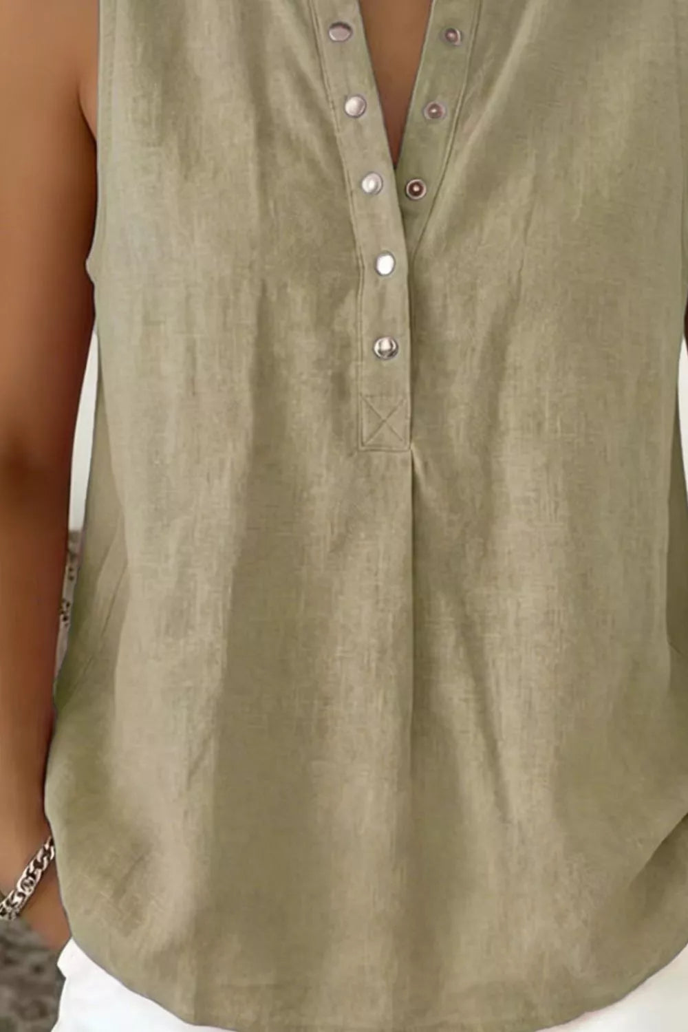 Sleeveless top shown layered under a blazer