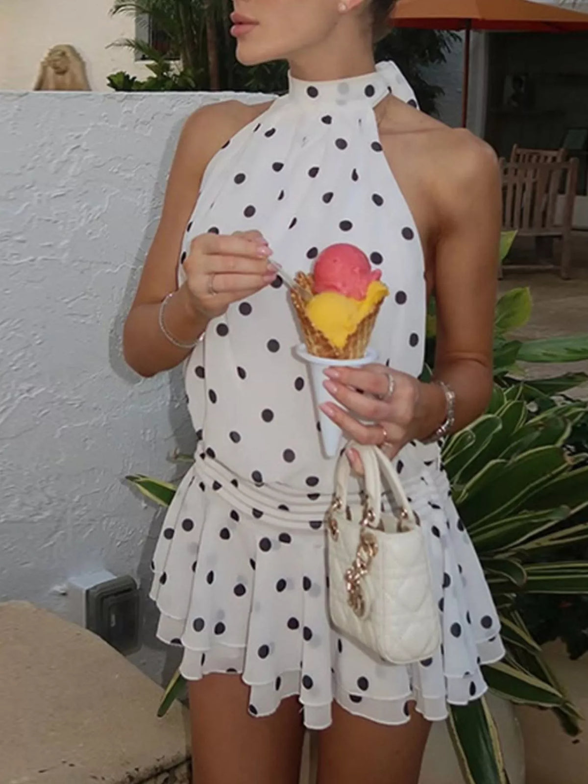 Ruched body detail on the polka dot halter dress