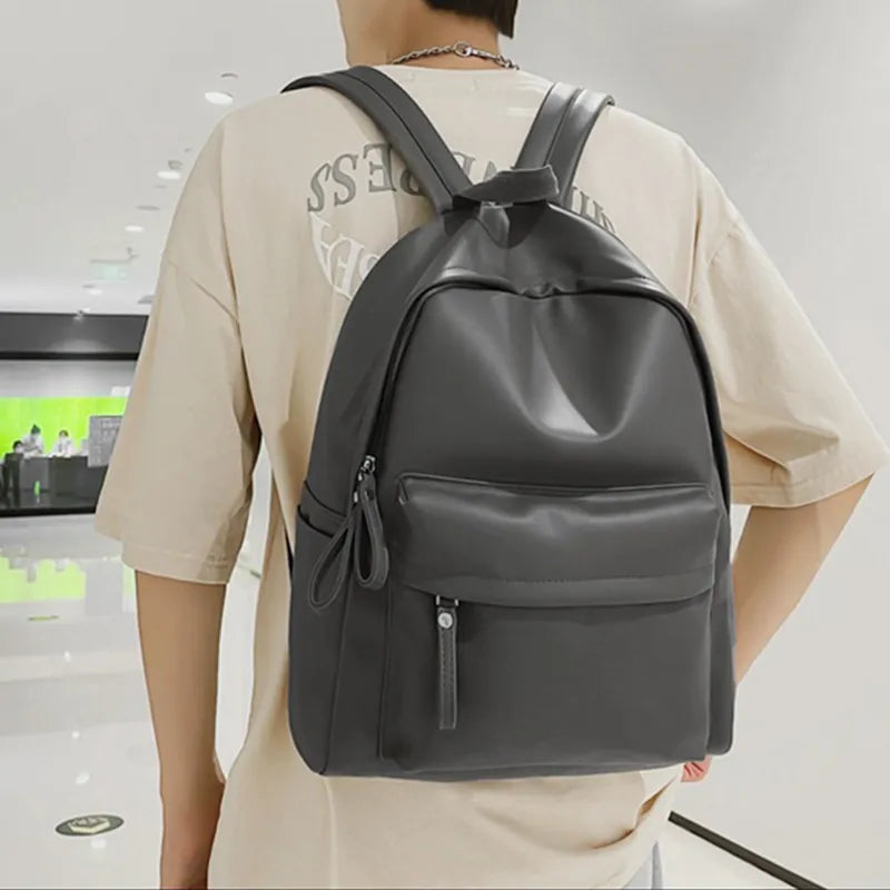 Faux leather zip backpack strap and buckle detail
