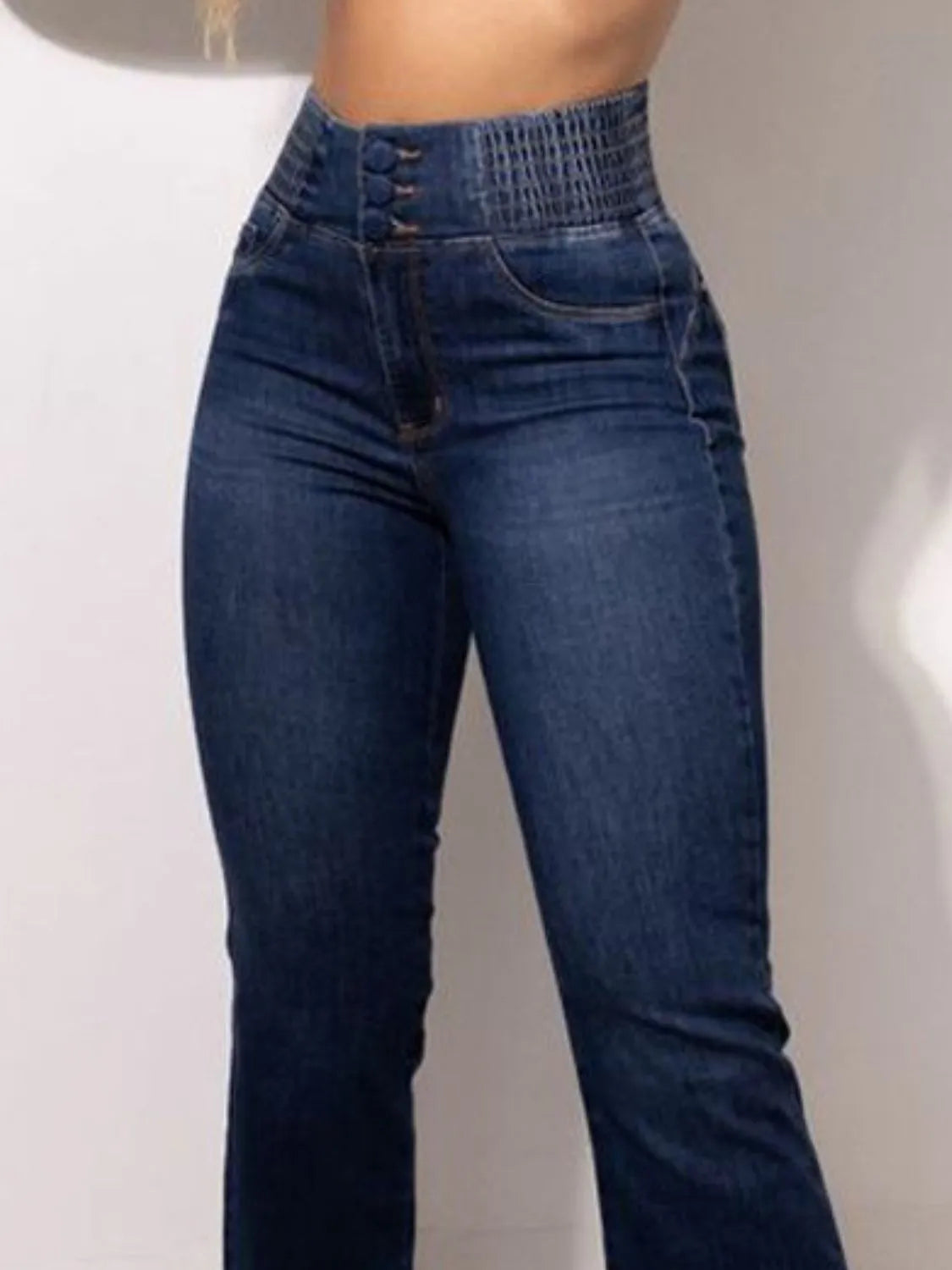 Side view of high rise bootcut denim