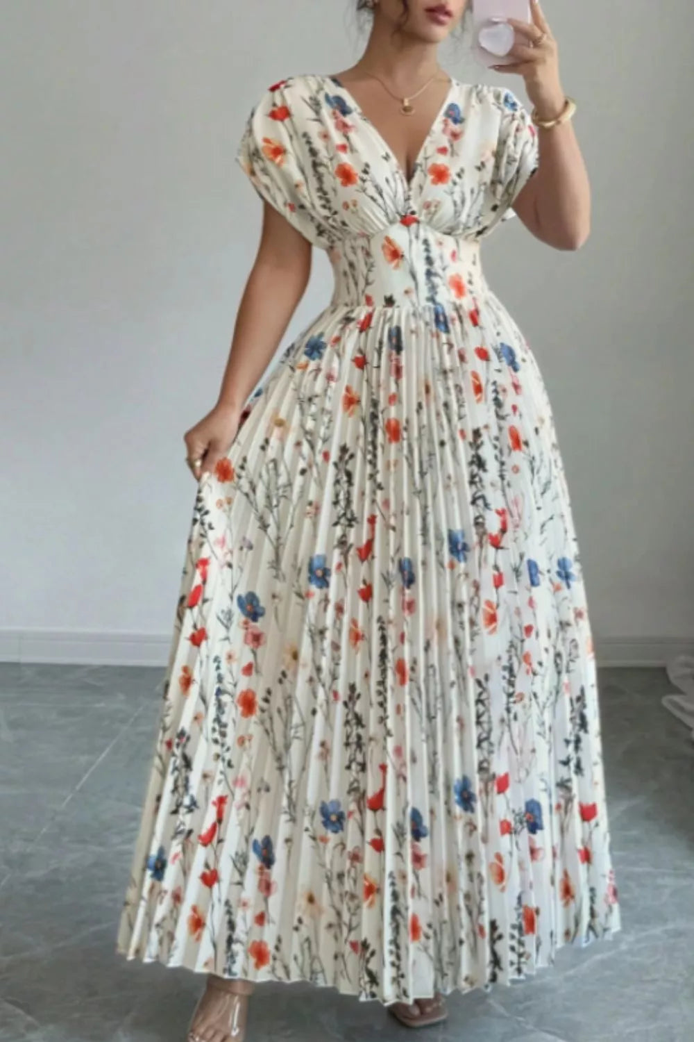 Pleated skirt detail on floral maxi dress
