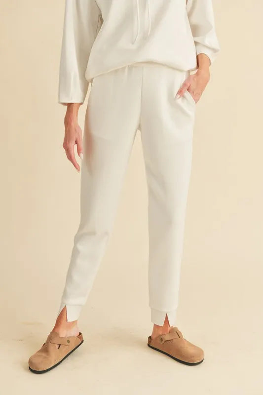 Cream joggers with pockets on model styling