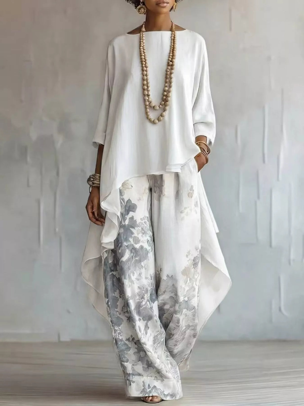 Asymmetrical hem top and floral pants two piece set front view