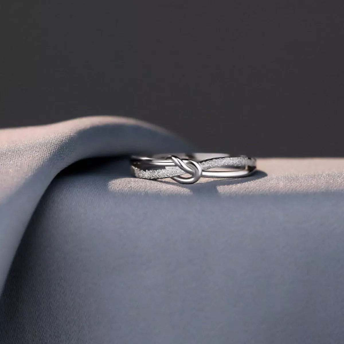Sterling silver zircon knot ring detail view