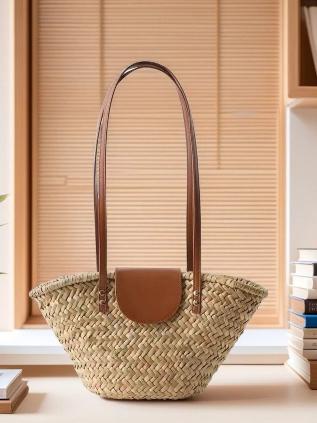 Back view of khaki straw shoulder bag