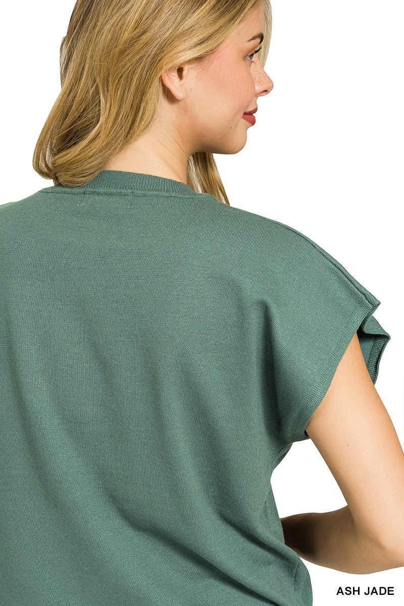 Round neckline detail on jade knit sweater