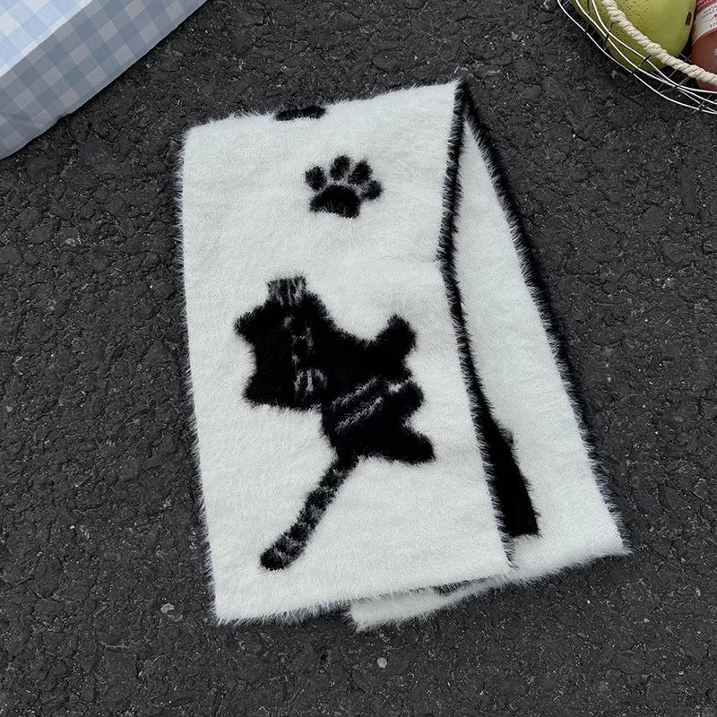 Detail of the soft plush texture of the cat paw scarf