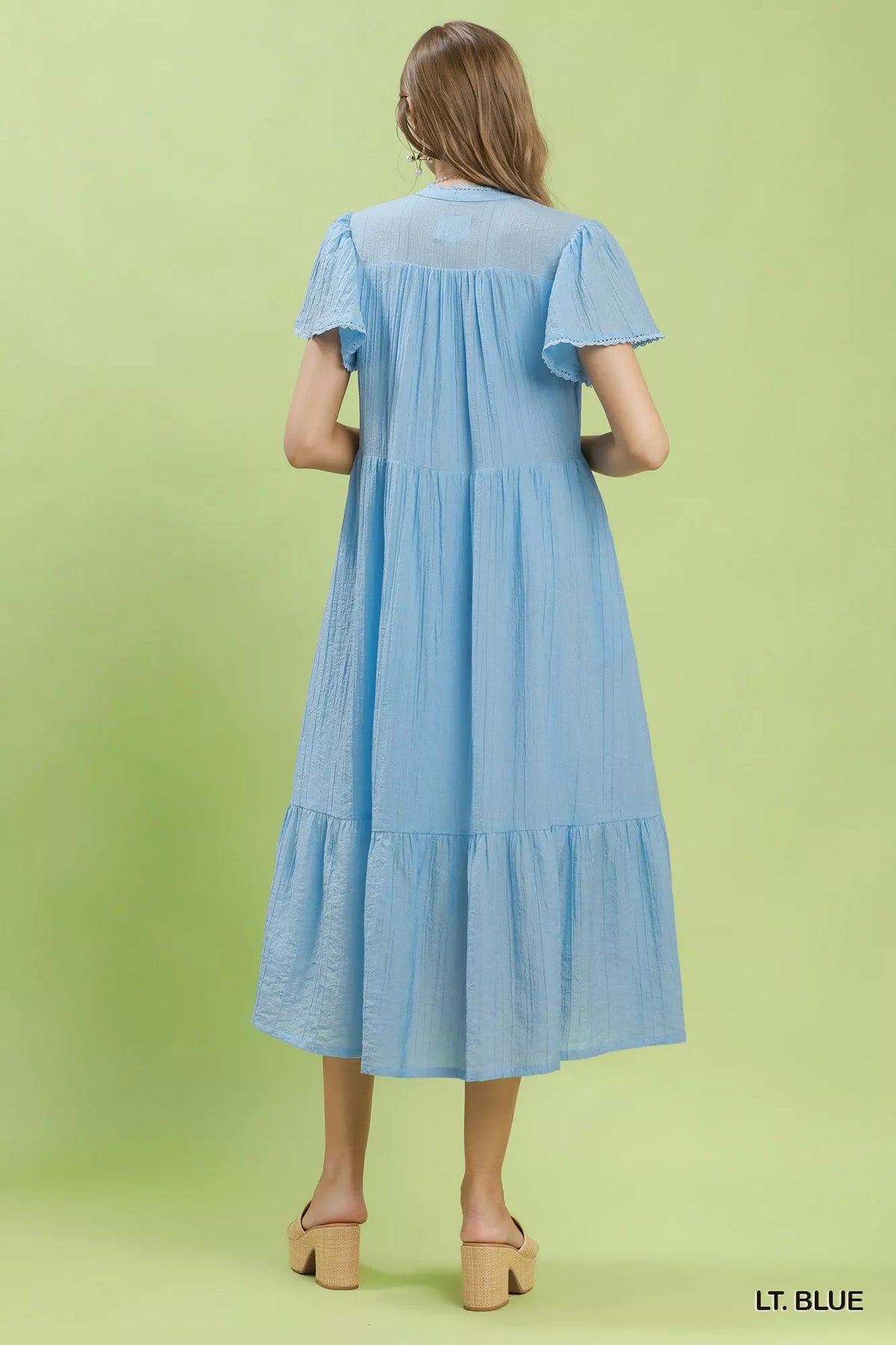 Light blue textured lace trim tiered midi dress back view