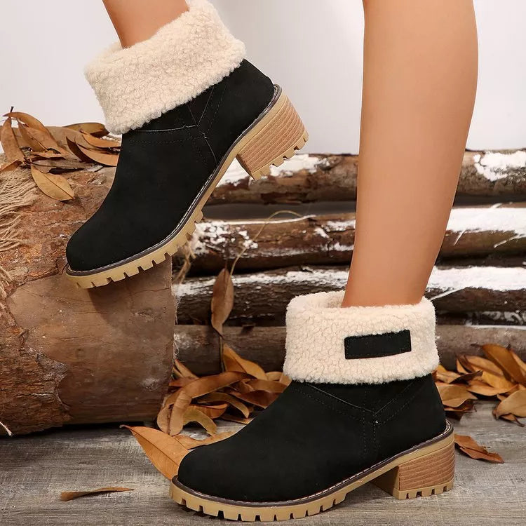 Suede round toe block heel boots pair standing