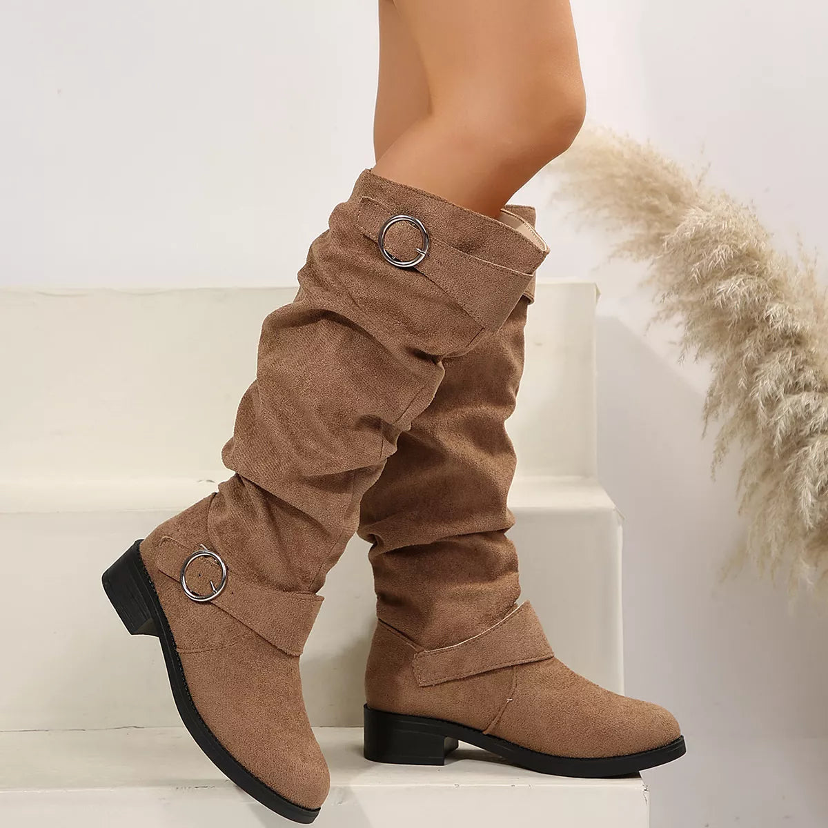 Black buckle accent slouch boots close up of the toe