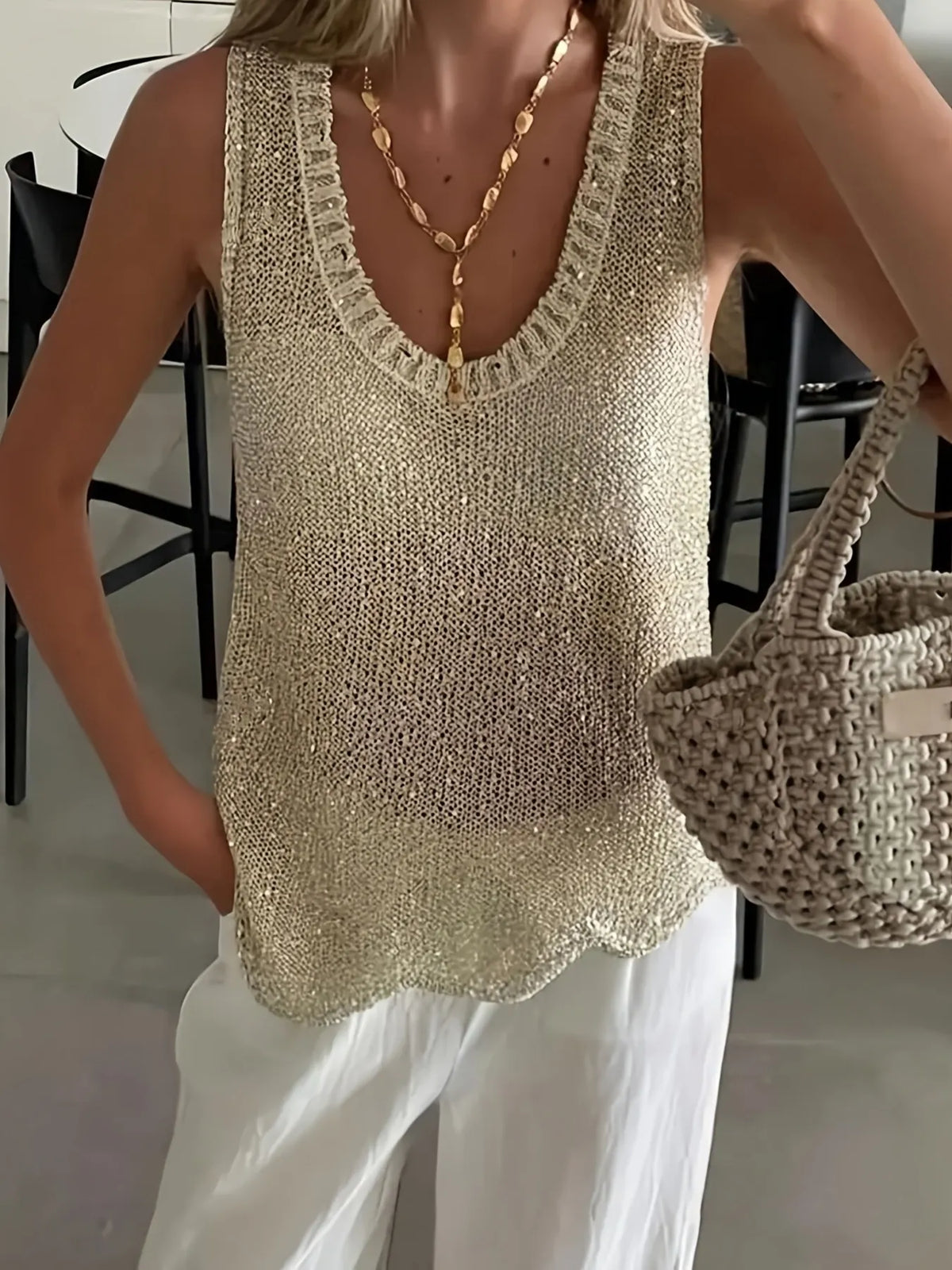 Scoop neck sweater vest, neckline close up