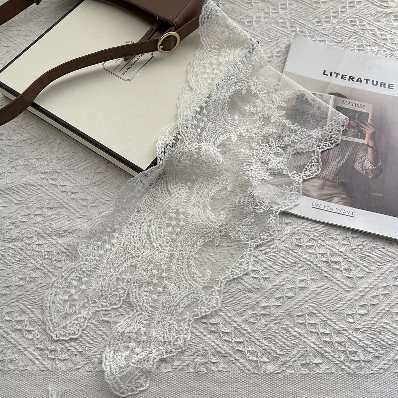 Elegant lace scarf tied at the neck