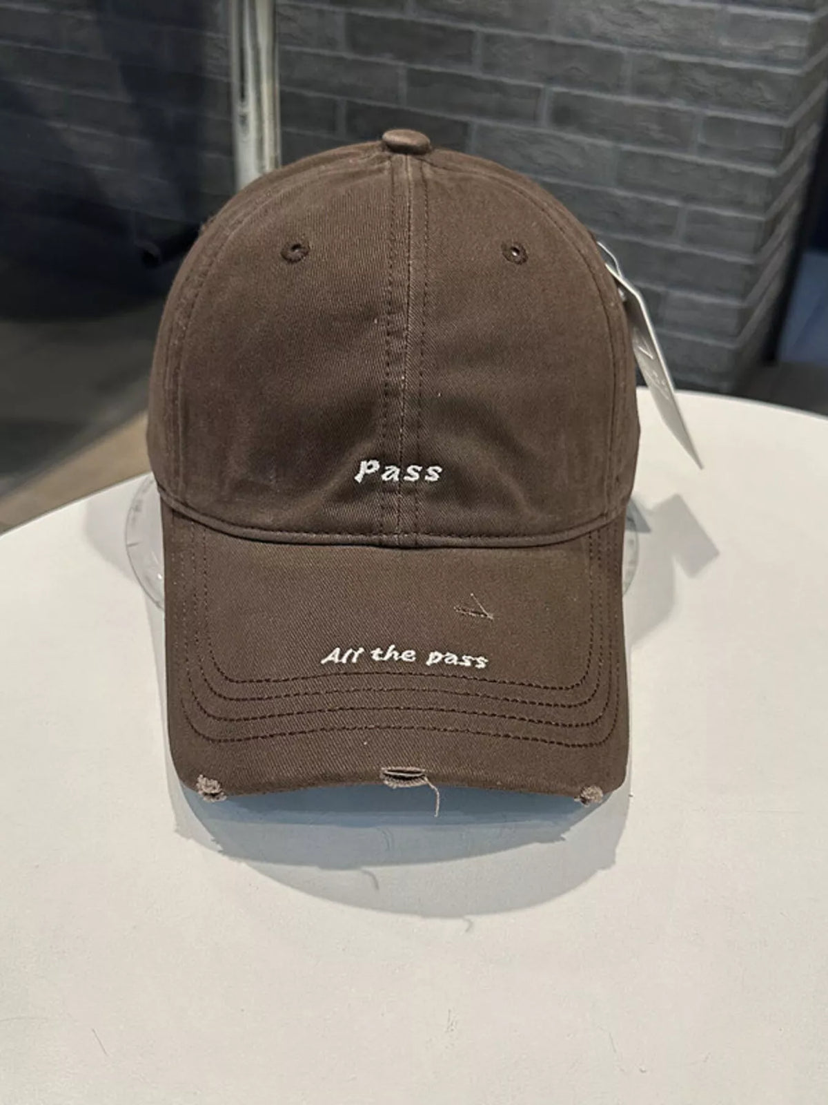 Distressed slogan baseball cap crown view