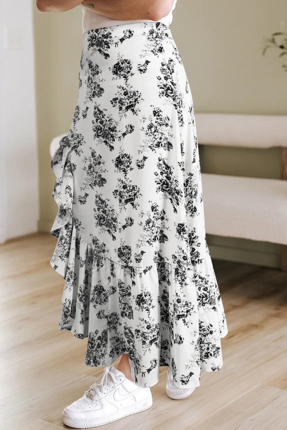 Detail of ruffled hem on boho floral skirt