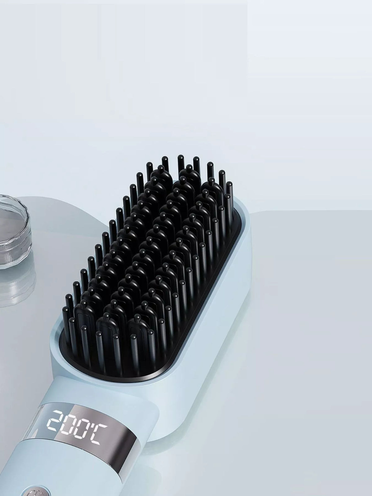 Straightening brush in use on hair