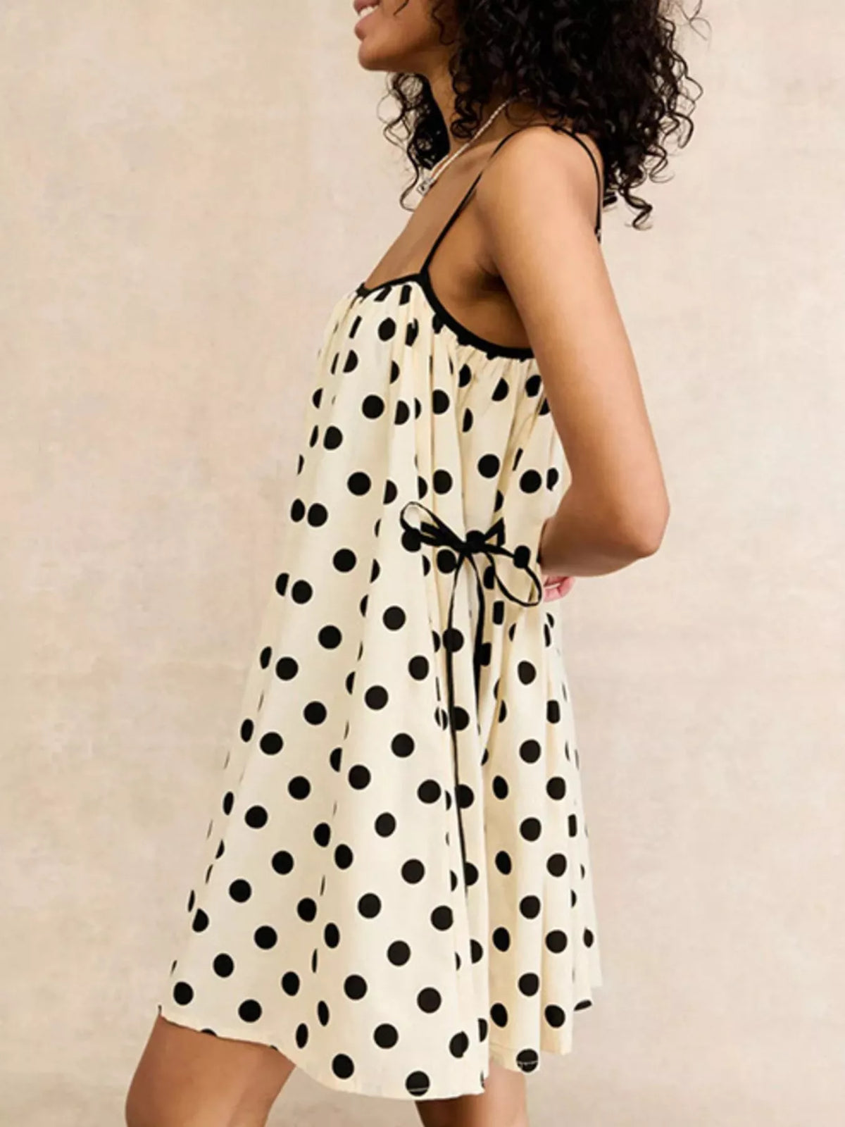 Front view of the polka dot spaghetti strap mini dress