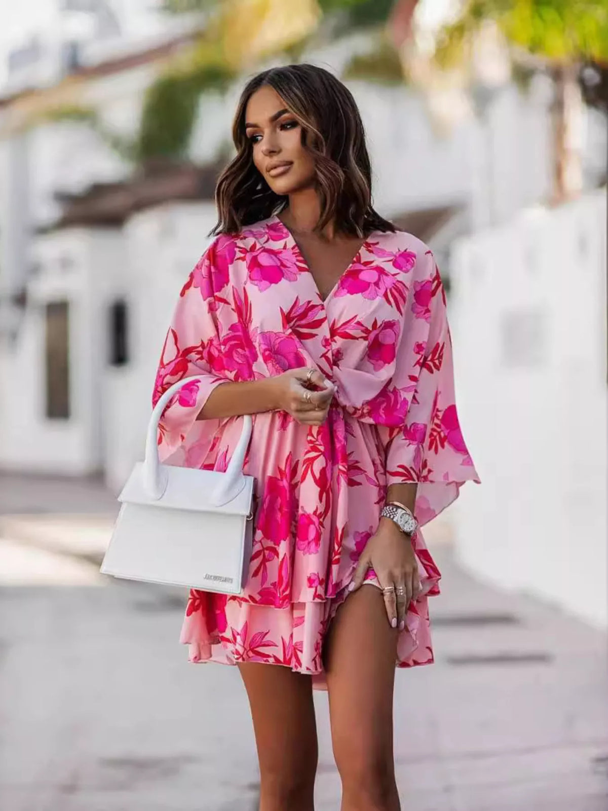 Printed surplice tiered mini dress detail view