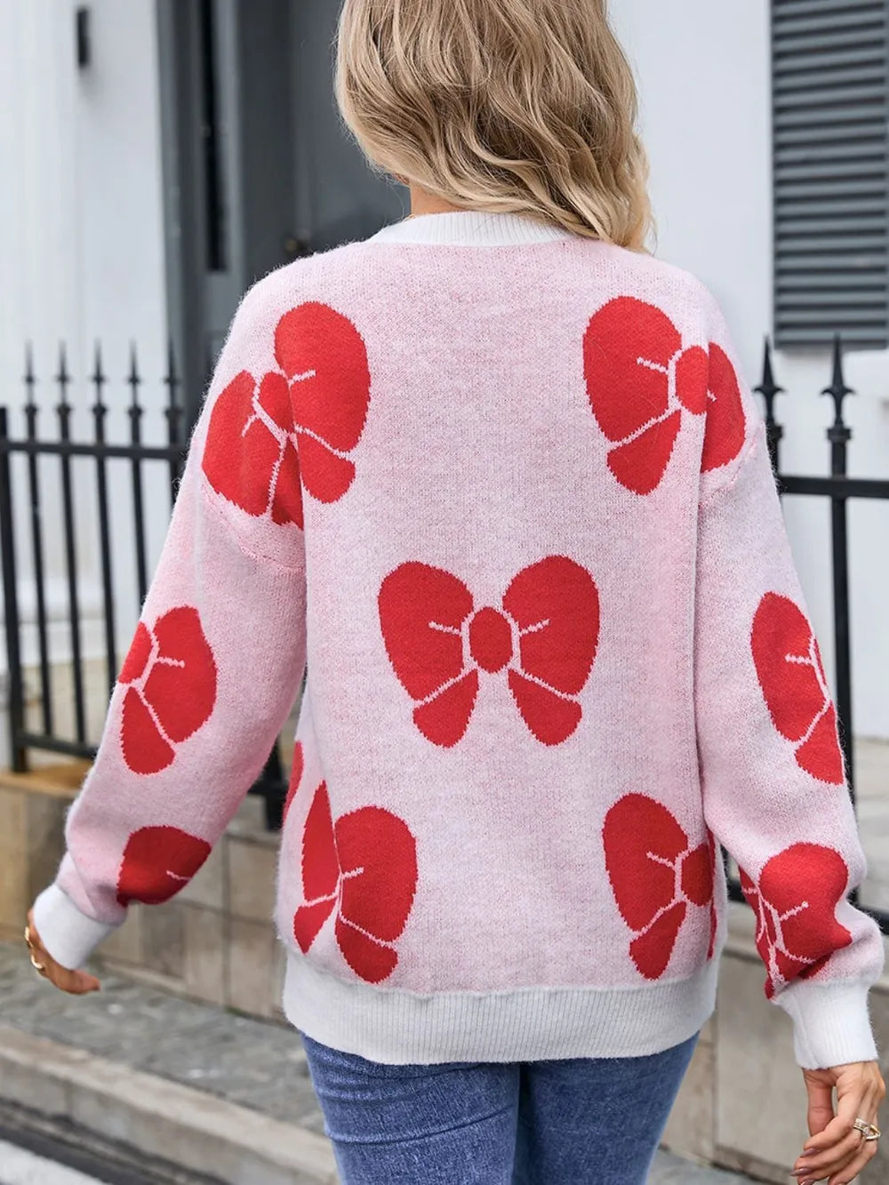 Bow detail knit sweater shown on model