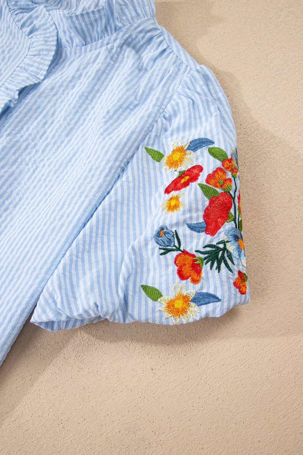 Light blue striped floral embroidered puff sleeve shirt styled view