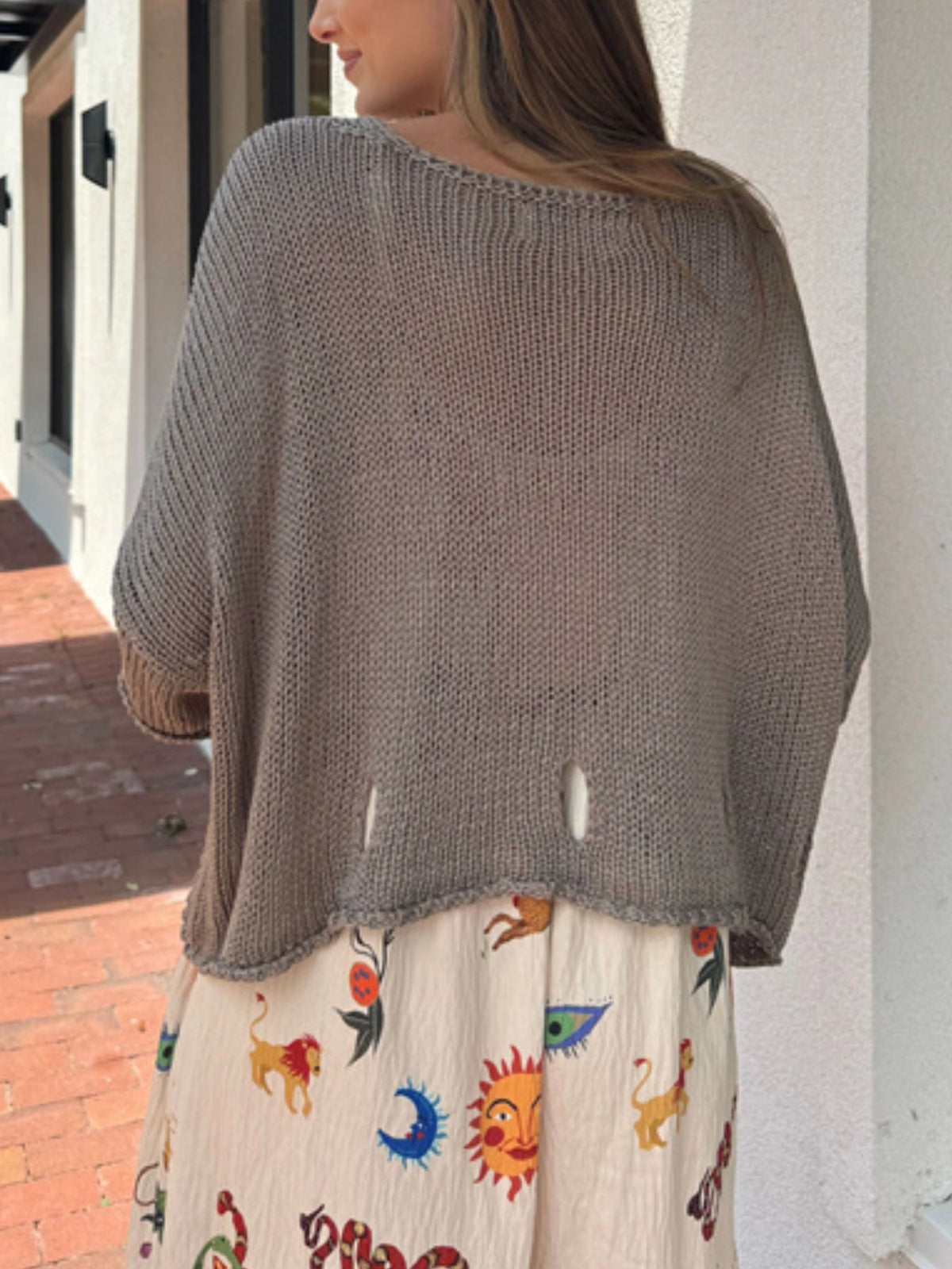 Cutout knit sweater sleeve and texture detail