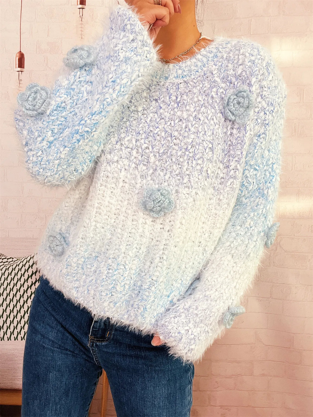 Flower embellished round neck sweater, studio front view
