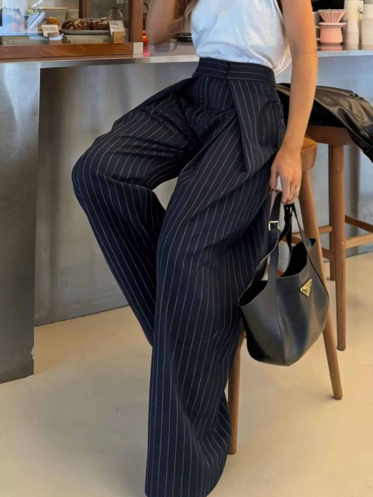 Dark blue striped wide leg trousers shown full length