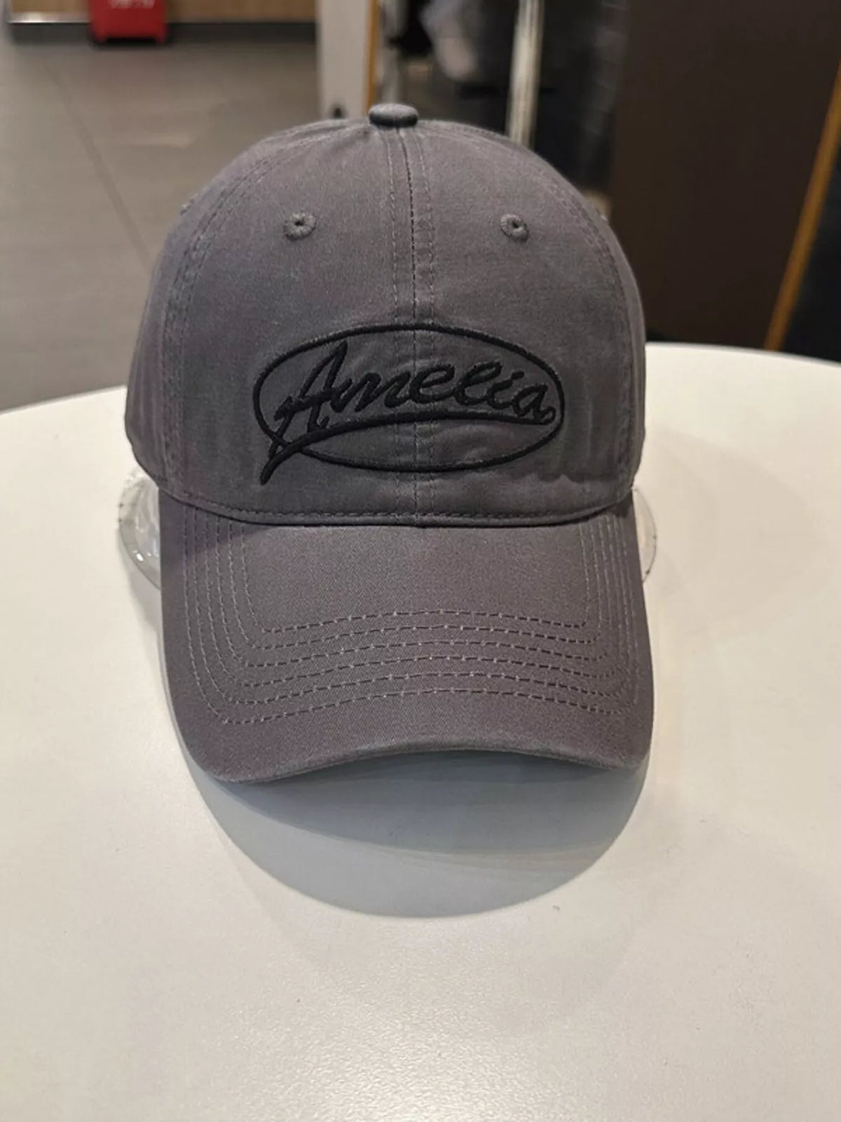 Side view of the cotton baseball cap showing the brim