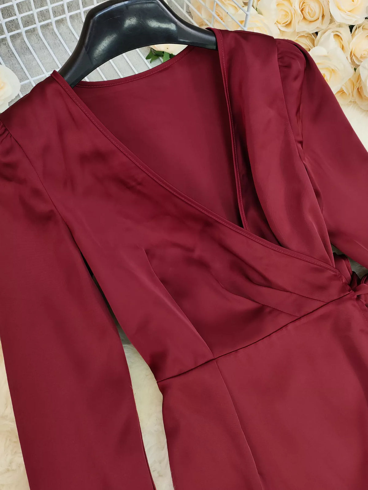 Red satin surplice long sleeve maxi dress close up