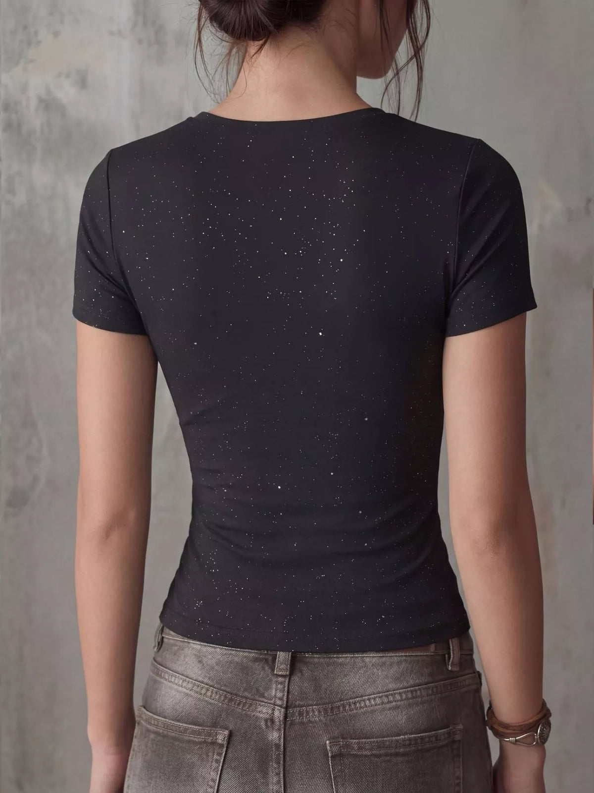 Black crossover short sleeve fitted tee detail of the fabric