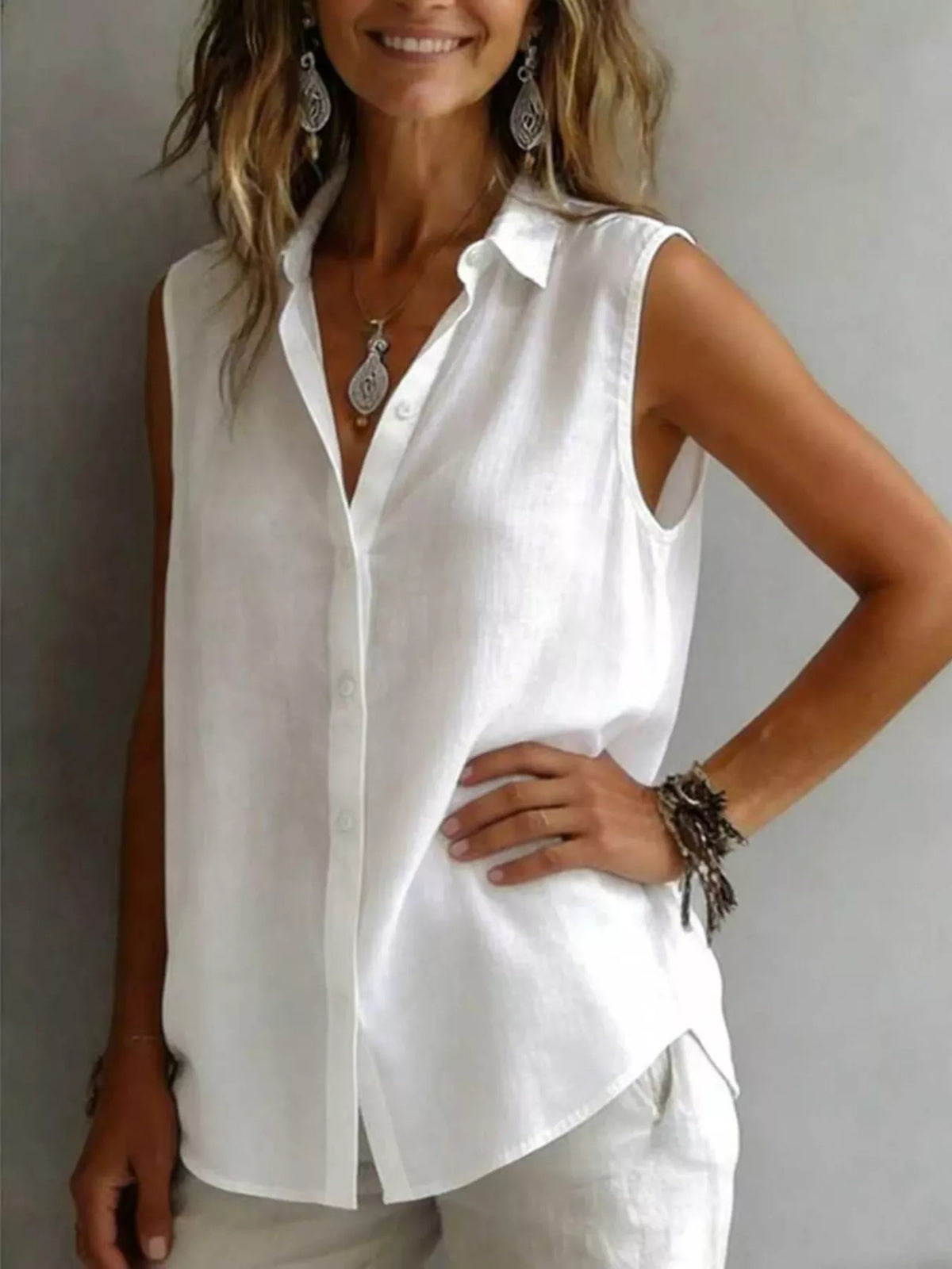 Sleeveless collared button down shirt styled view