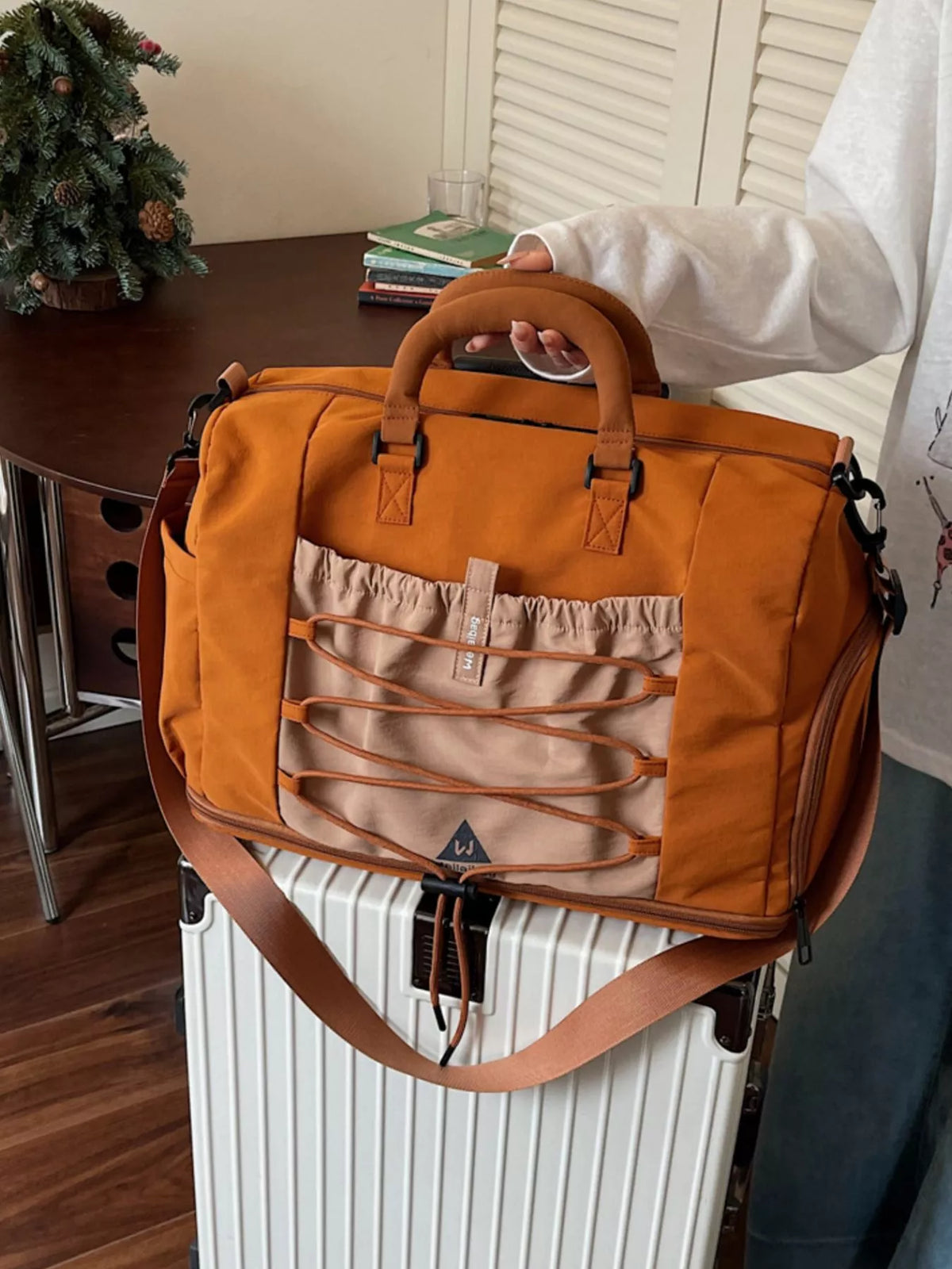 Brown nylon multi pocket travel duffel bag front view