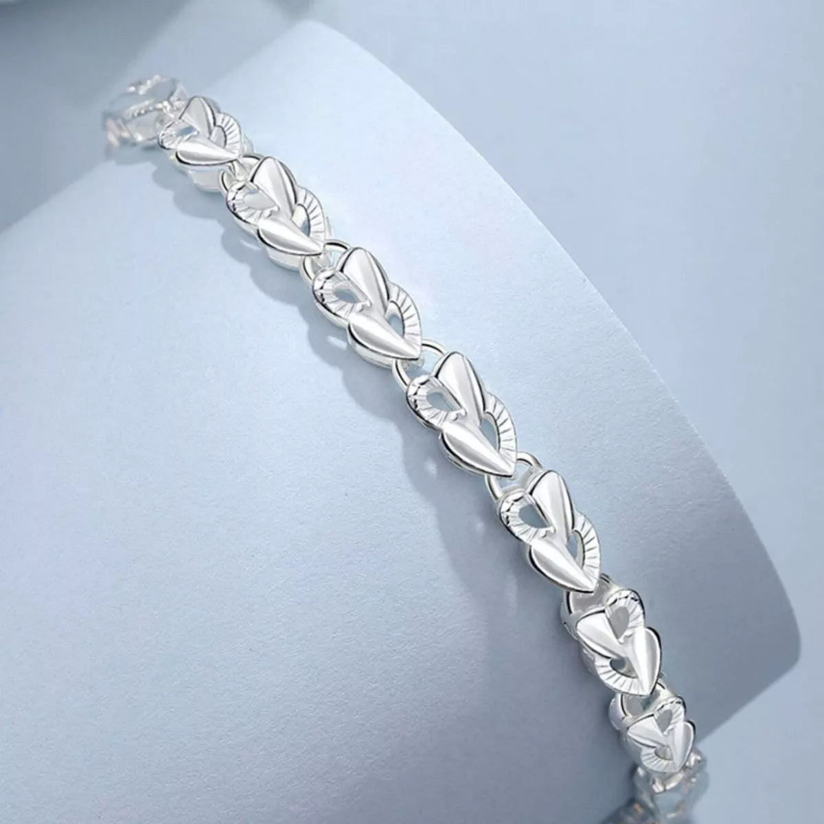 925 sterling silver heart link bracelet laid flat