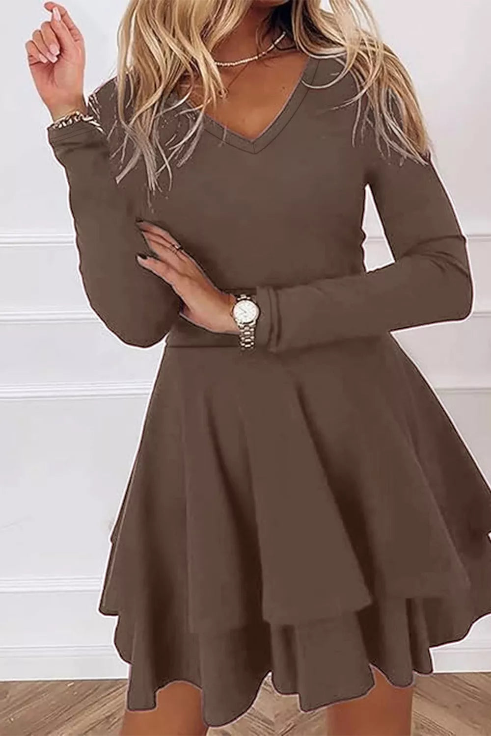 Back view of long sleeve layered mini dress