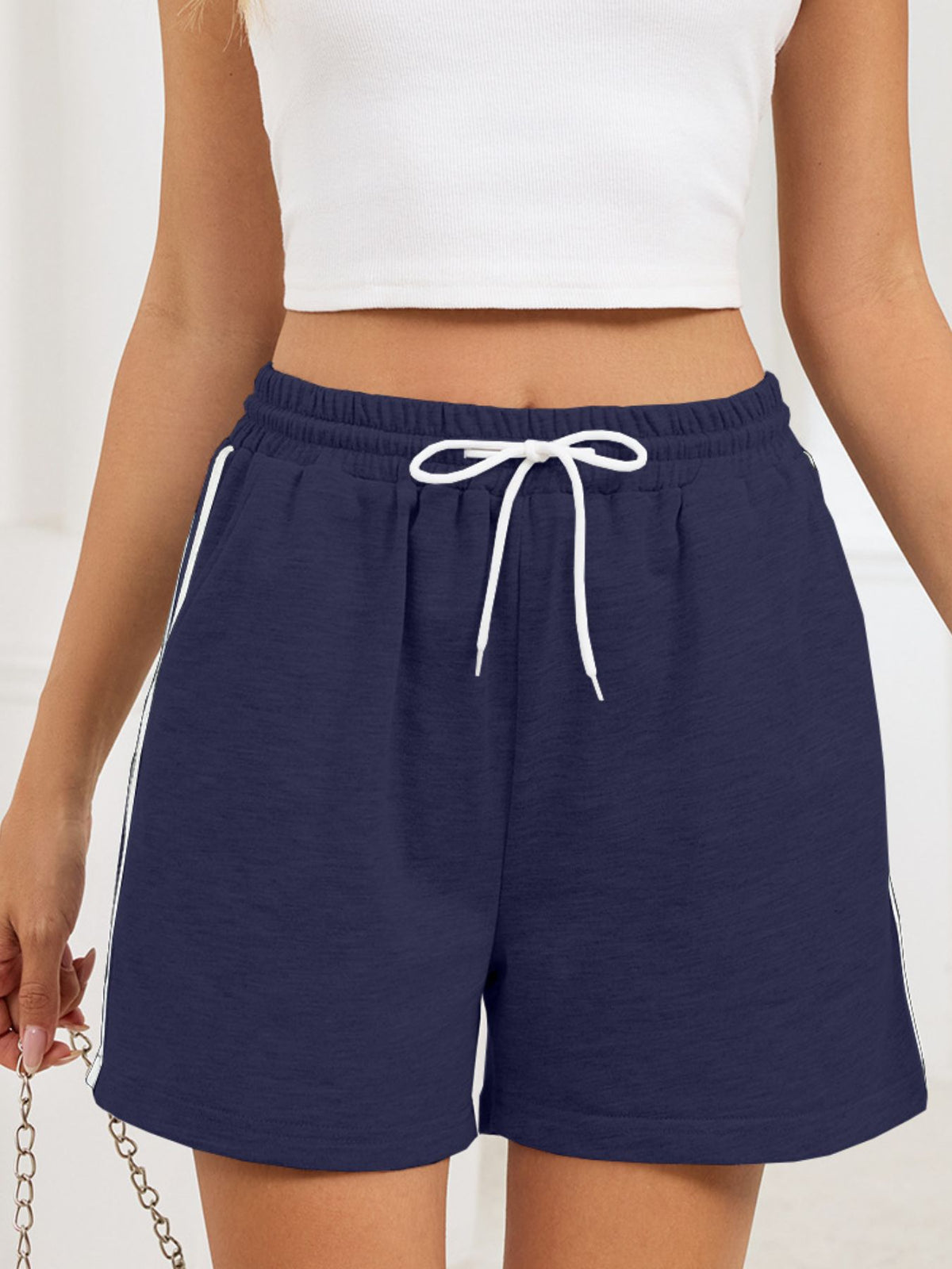 Final view of the drawstring shorts styled casually